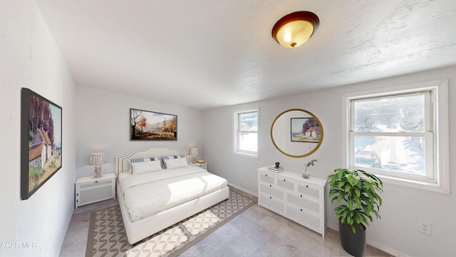 bedroom featuring baseboards