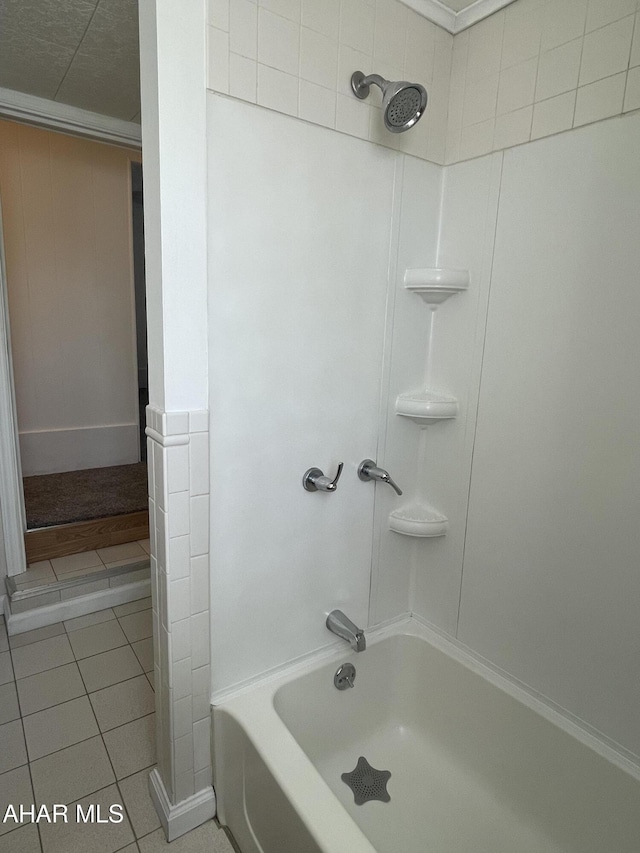 bathroom with tile patterned flooring and shower / tub combination