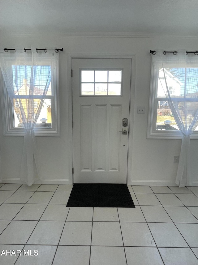 510 Ashcroft Ave, Cresson, PA 16630 - doorway to outside featuring baseboards, ornamental molding, and light tile patterned floors