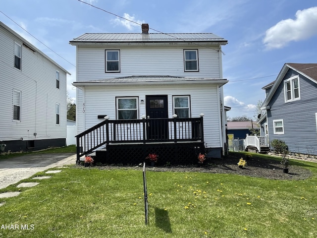 510 Ashcroft Ave, Cresson, PA 16630 - back of property with a lawn, a chimney, a porch, and metal roof