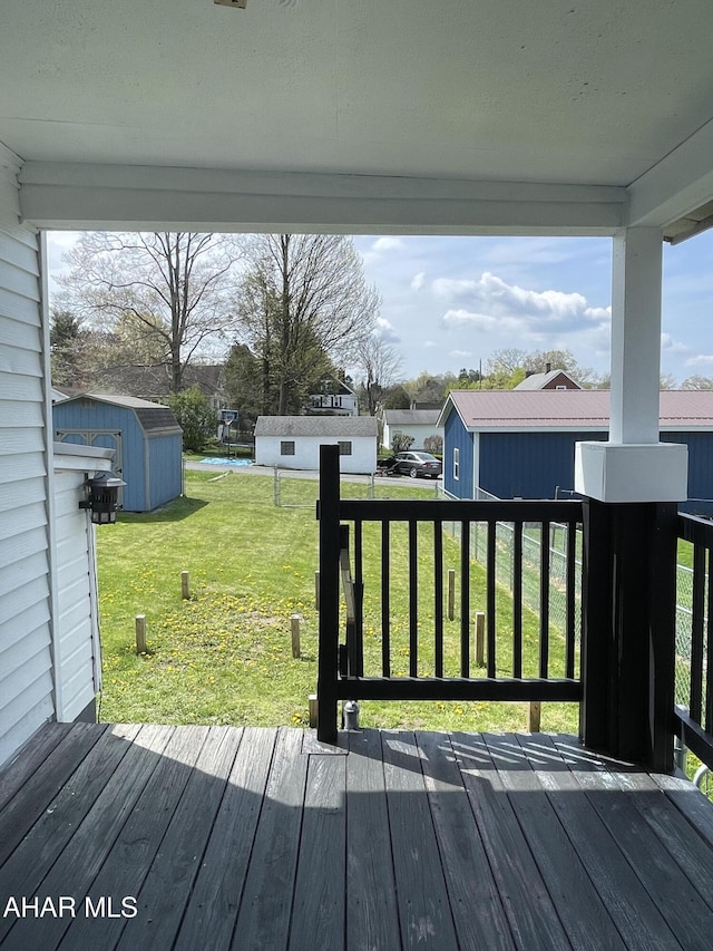 510 Ashcroft Ave, Cresson, PA 16630 - wooden terrace featuring a storage shed, a lawn, and an outbuilding