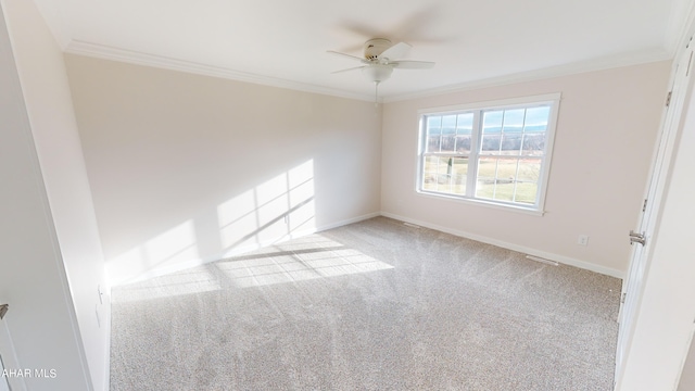 carpeted empty room featuring ornamental molding and ceiling fan