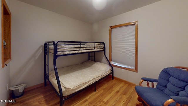 bedroom with light hardwood / wood-style flooring