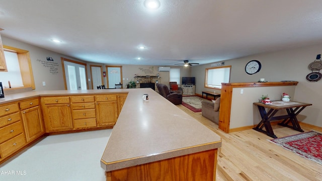 kitchen with light hardwood / wood-style floors and ceiling fan