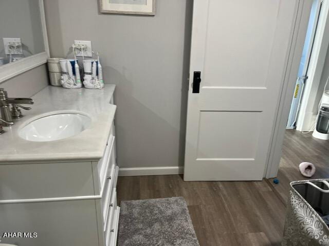 bathroom featuring hardwood / wood-style floors and vanity