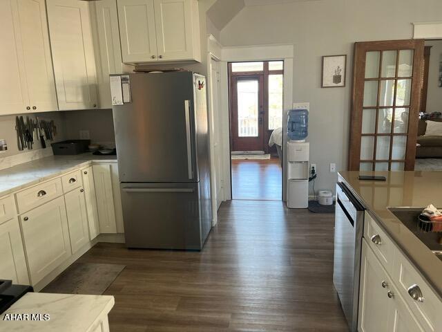 kitchen featuring white cabinets, dark wood-type flooring, and appliances with stainless steel finishes