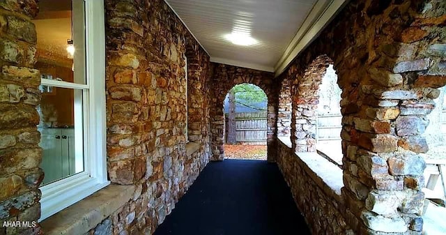 corridor with vaulted ceiling