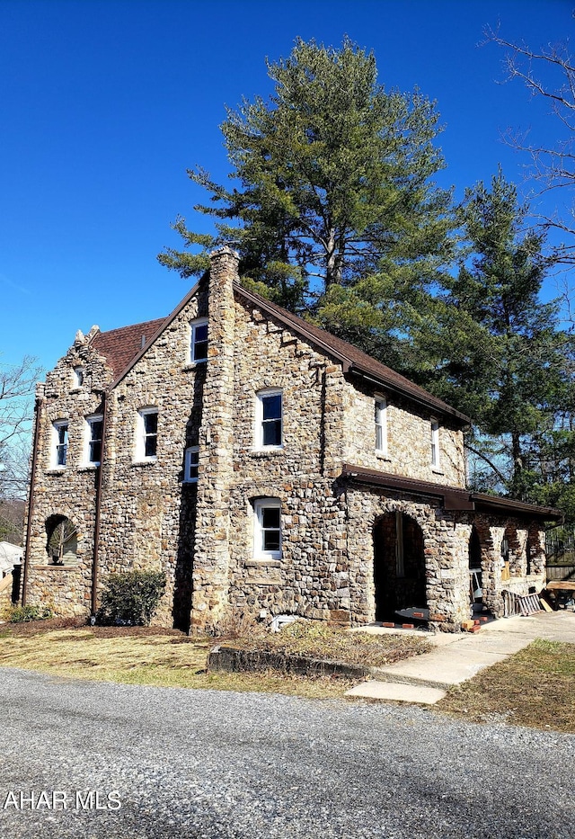 1761 Princeton Rd, Altoona, PA 16602 - view of side of home featuring a chimney and stone siding