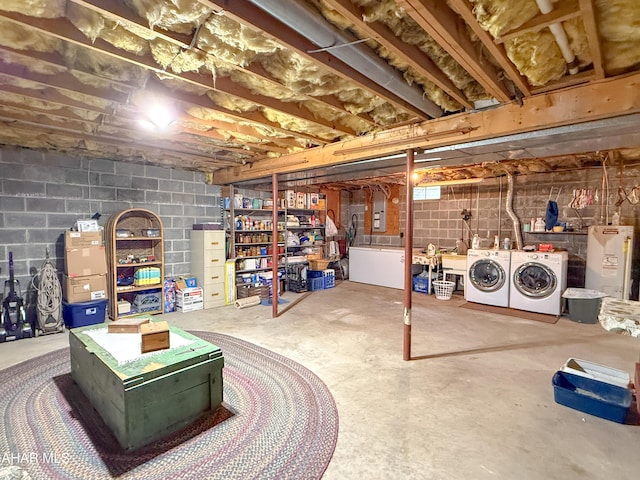 6334 Black Valley Rd, Everett, PA 15537 - unfinished below grade area featuring concrete block wall, electric water heater, and washer and clothes dryer