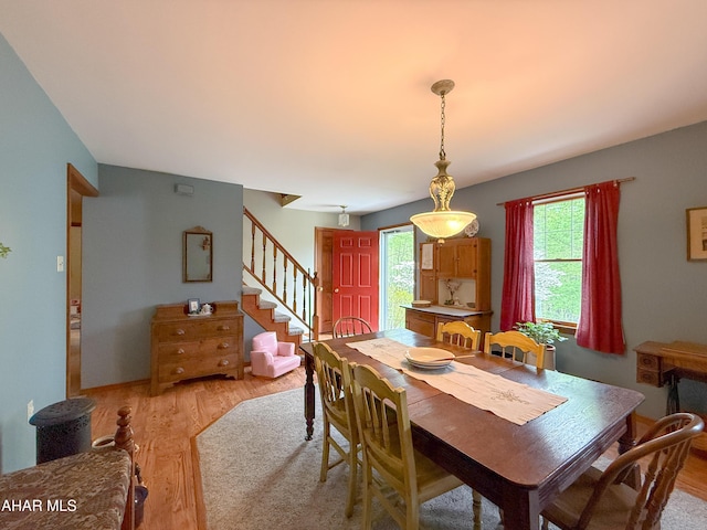 6334 Black Valley Rd, Everett, PA 15537 - dining area featuring light wood-type flooring and stairs