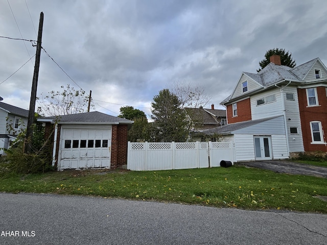 view of side of property with a lawn