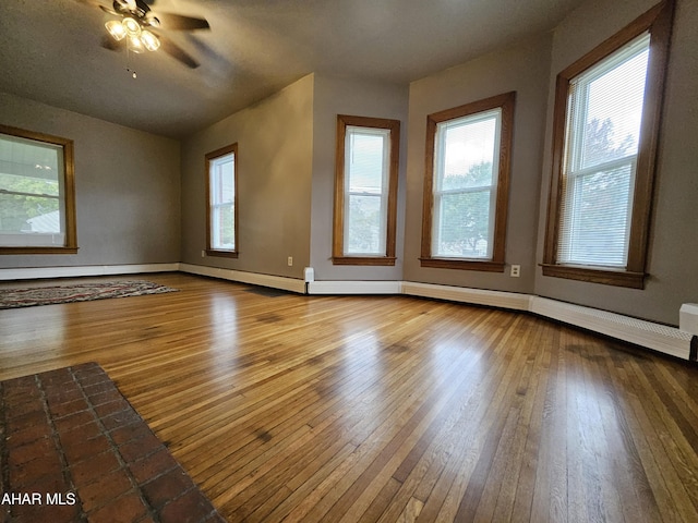 interior space with hardwood / wood-style flooring and ceiling fan