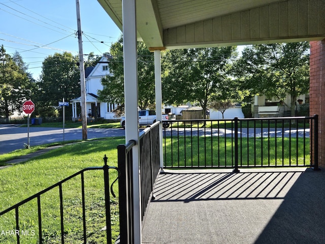 exterior space with a porch and a yard