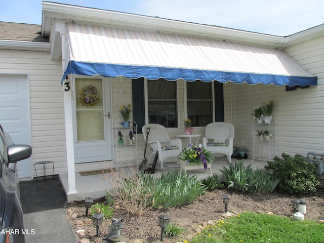 doorway to property with a porch