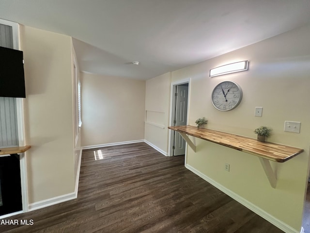 interior space with dark hardwood / wood-style floors