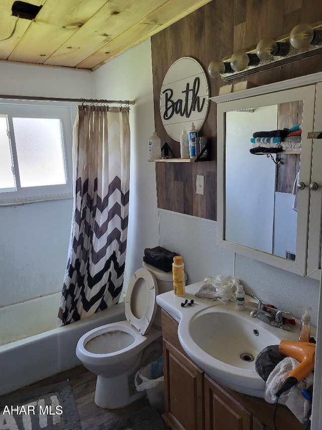 2521 Holland Ave, Huntingdon, PA 16652 - bathroom featuring vanity, toilet, wood finished floors, shower / bathtub combination with curtain, and wood walls