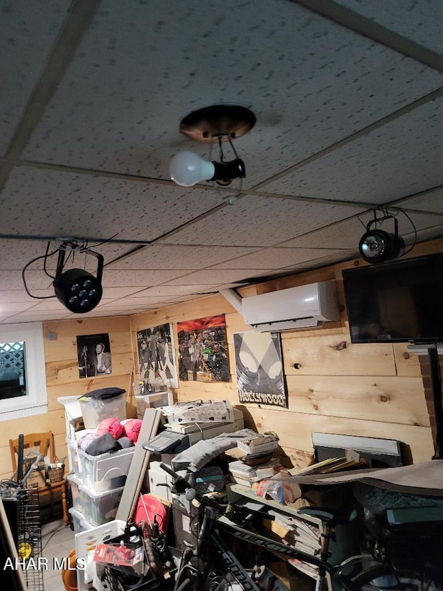 2521 Holland Ave, Huntingdon, PA 16652 - misc room with a wall unit AC, wood walls, and a drop ceiling