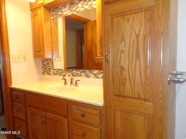 bathroom featuring decorative backsplash and vanity