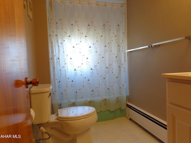 bathroom with tile patterned floors, a baseboard heating unit, toilet, and vanity