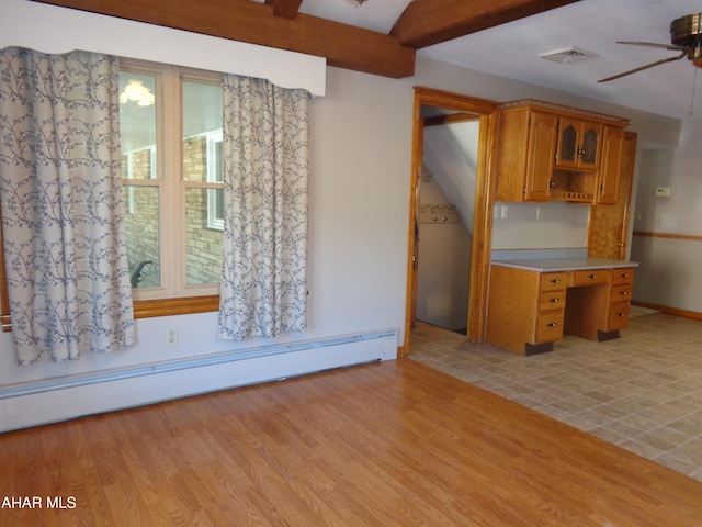 kitchen with light wood finished floors, a baseboard heating unit, beamed ceiling, light countertops, and open shelves