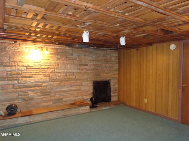 finished below grade area with wooden ceiling and wooden walls