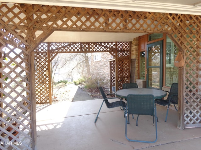 view of patio with a gazebo and outdoor dining area