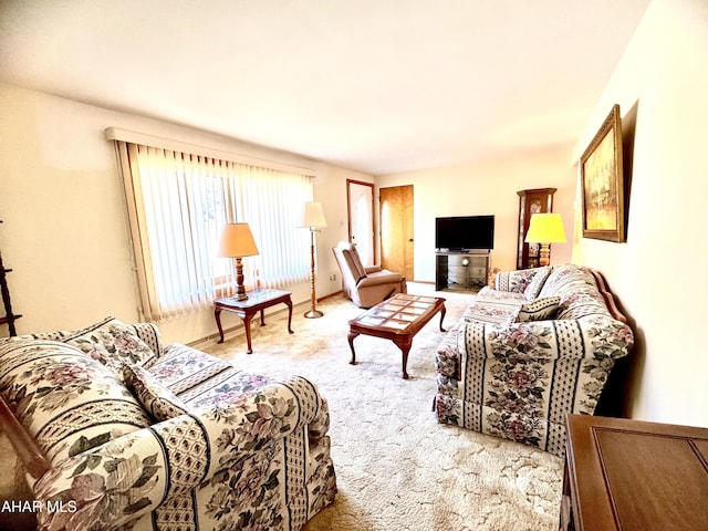 living room featuring baseboards and carpet floors