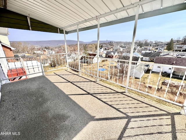 view of patio / terrace featuring a mountain view and a balcony