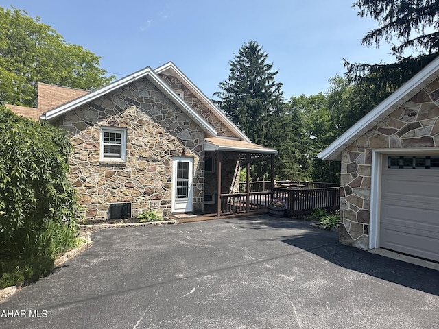 328 Avalon Rd, Altoona, PA 16601 - view of side of home featuring stone siding and a wooden deck