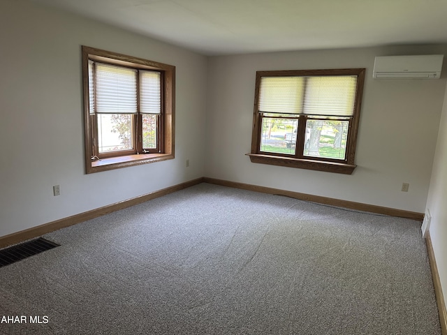 328 Avalon Rd, Altoona, PA 16601 - carpeted empty room featuring an AC wall unit and plenty of natural light