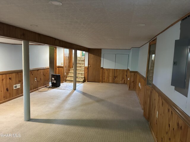 328 Avalon Rd, Altoona, PA 16601 - basement with wood walls, a wainscoted wall, carpet floors, electric panel, and stairway
