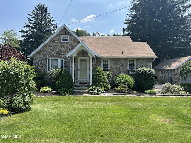 328 Avalon Rd, Altoona, PA 16601 - tudor house featuring stone siding and a front lawn
