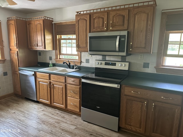 328 Avalon Rd, Altoona, PA 16601 - kitchen with stainless steel appliances, plenty of natural light, light wood-style floors, and dark countertops