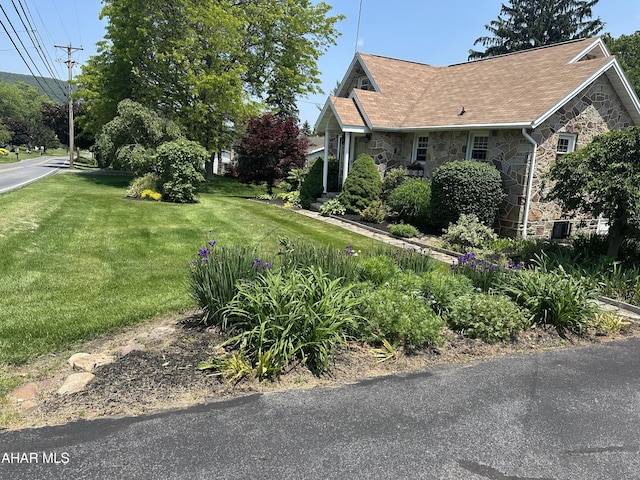 328 Avalon Rd, Altoona, PA 16601 - view of side of property with stone siding, a yard, and roof with shingles