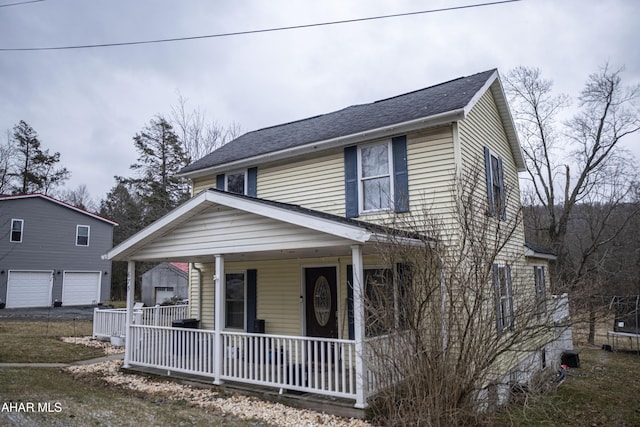 view of front of house featuring a porch and a shingled roof