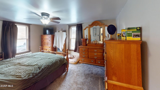 bedroom featuring a ceiling fan and carpet floors