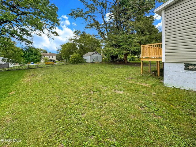 view of yard featuring a wooden deck