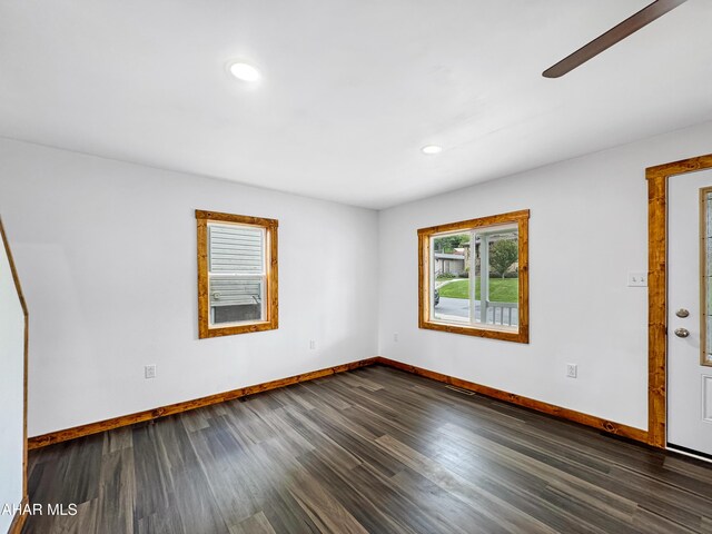 spare room with dark hardwood / wood-style floors