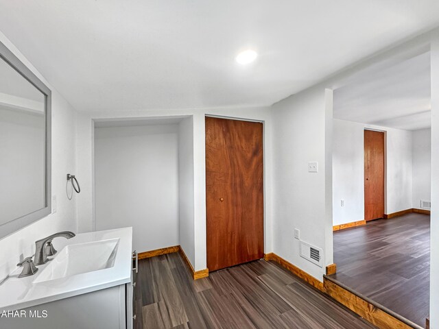 bathroom featuring vanity and hardwood / wood-style flooring