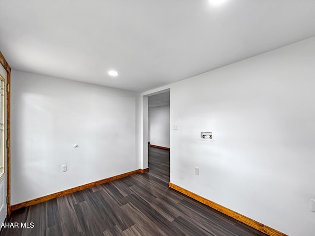 spare room featuring dark hardwood / wood-style floors