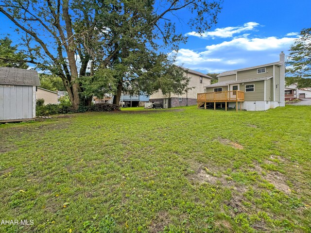 view of yard featuring a deck