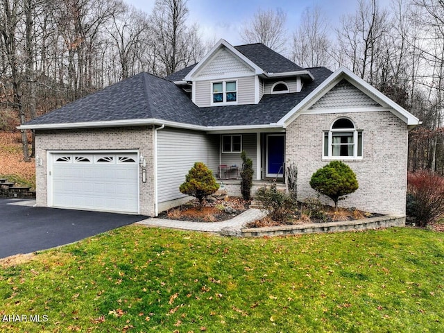 view of front of home featuring a garage and a front lawn