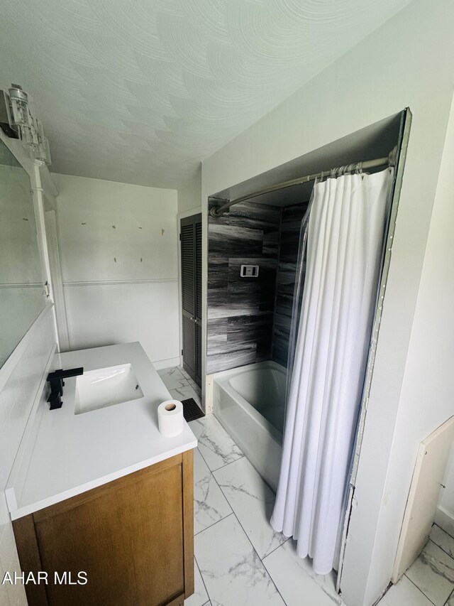 5017 Highland Park Ave, Altoona, PA 16602 - bathroom with marble finish floors, vanity, shower / tub combo, and a textured ceiling