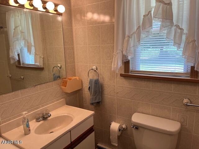 6331 Hyndaman Rd, Buffalo Mills, PA 15534 - bathroom with tile walls, vanity, and tasteful backsplash