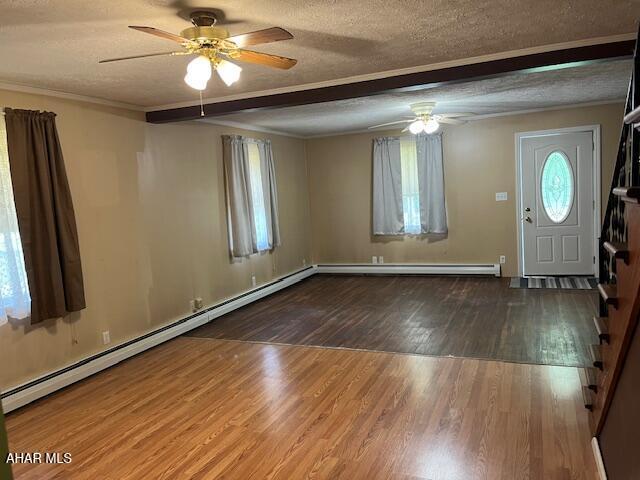 6331 Hyndaman Rd, Buffalo Mills, PA 15534 - foyer with a ceiling fan, a textured ceiling, wood finished floors, baseboard heating, and ornamental molding