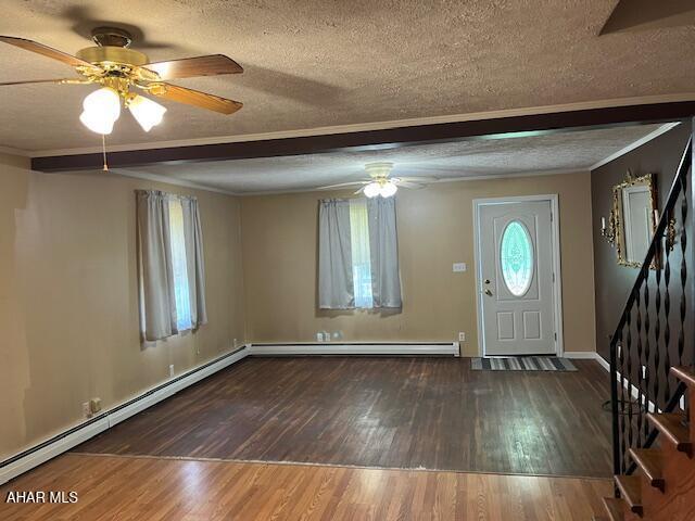 6331 Hyndaman Rd, Buffalo Mills, PA 15534 - foyer entrance featuring a ceiling fan, a textured ceiling, baseboard heating, stairway, and wood finished floors
