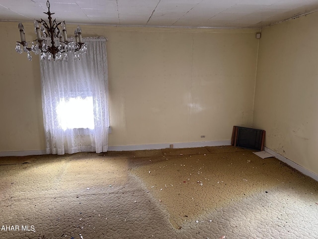 unfurnished room with an inviting chandelier