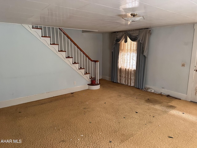 unfurnished living room with carpet flooring