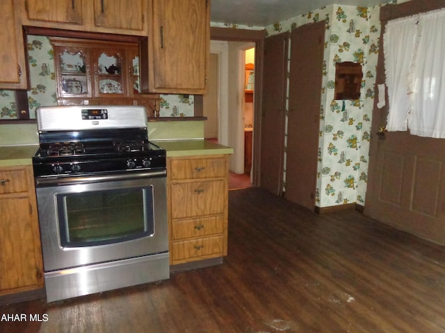 708 Blair St, Hollidaysburg, PA 16648 - kitchen with stainless steel gas range oven, dark wood-style flooring, and wallpapered walls