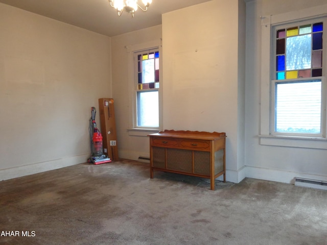 708 Blair St, Hollidaysburg, PA 16648 - carpeted spare room with a chandelier, a baseboard heating unit, and baseboards